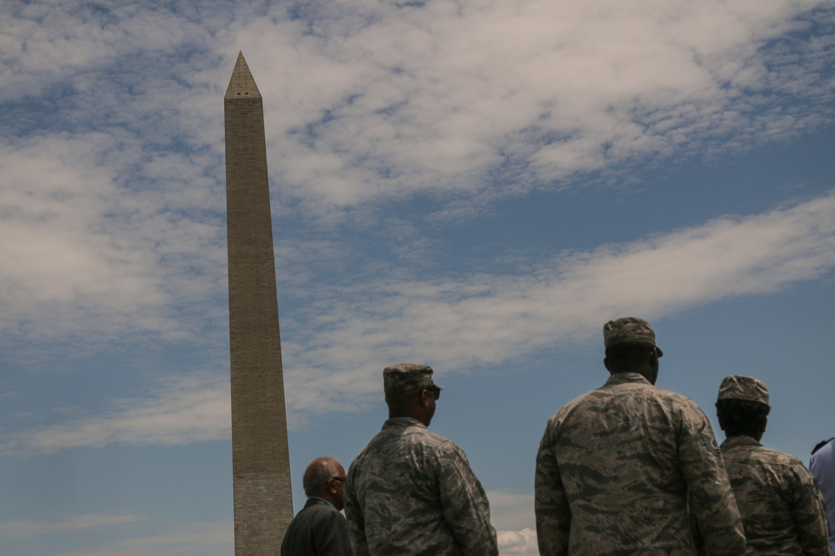 Soldiers gather near the Washington Monument