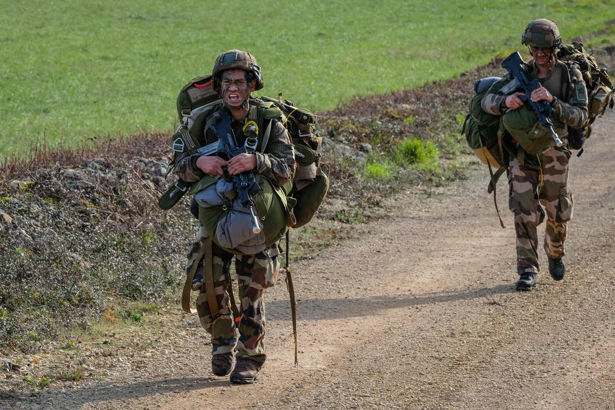 soldiers carrying their parachute after their jump from a plane in south of France