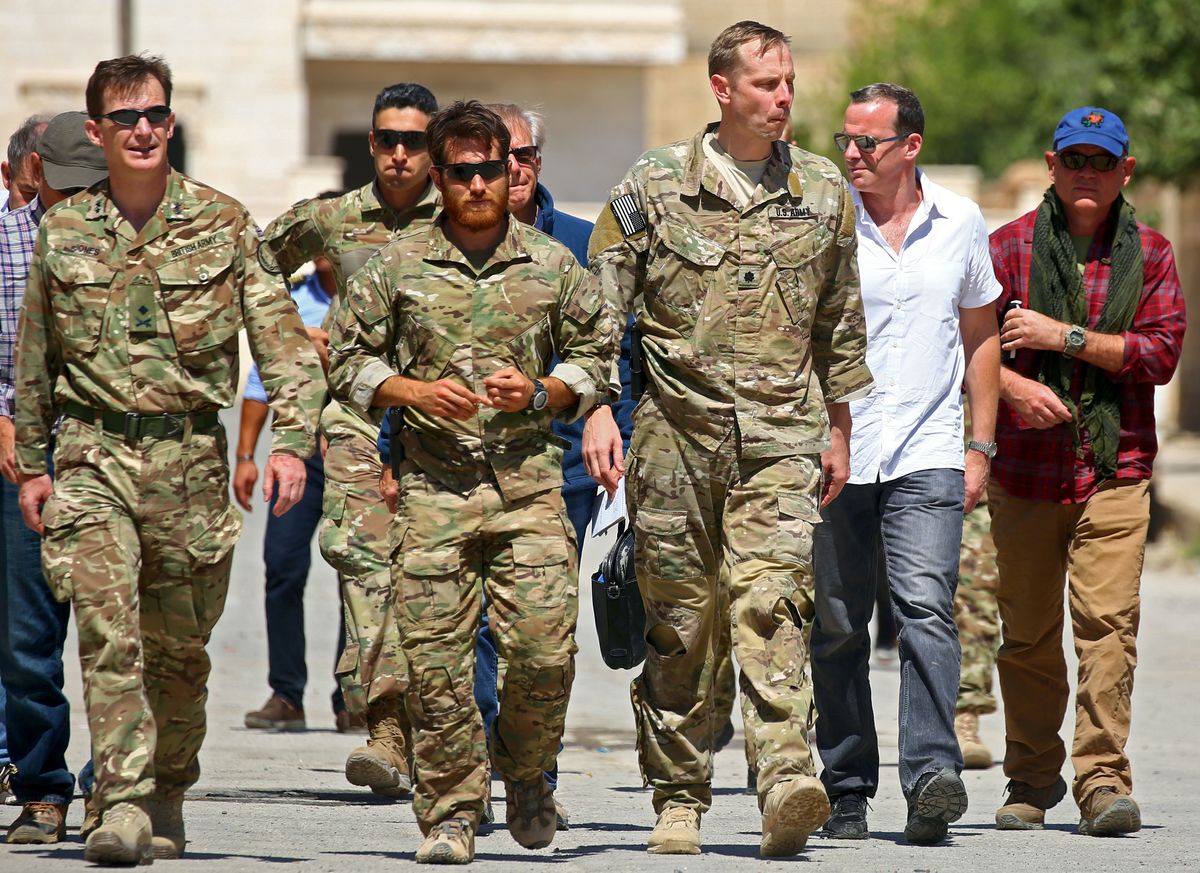 Combined Joint Task Force Operation Inherent Resolve (CJTF-OIR), arrive for a meeting with the Tabqa Civil Council