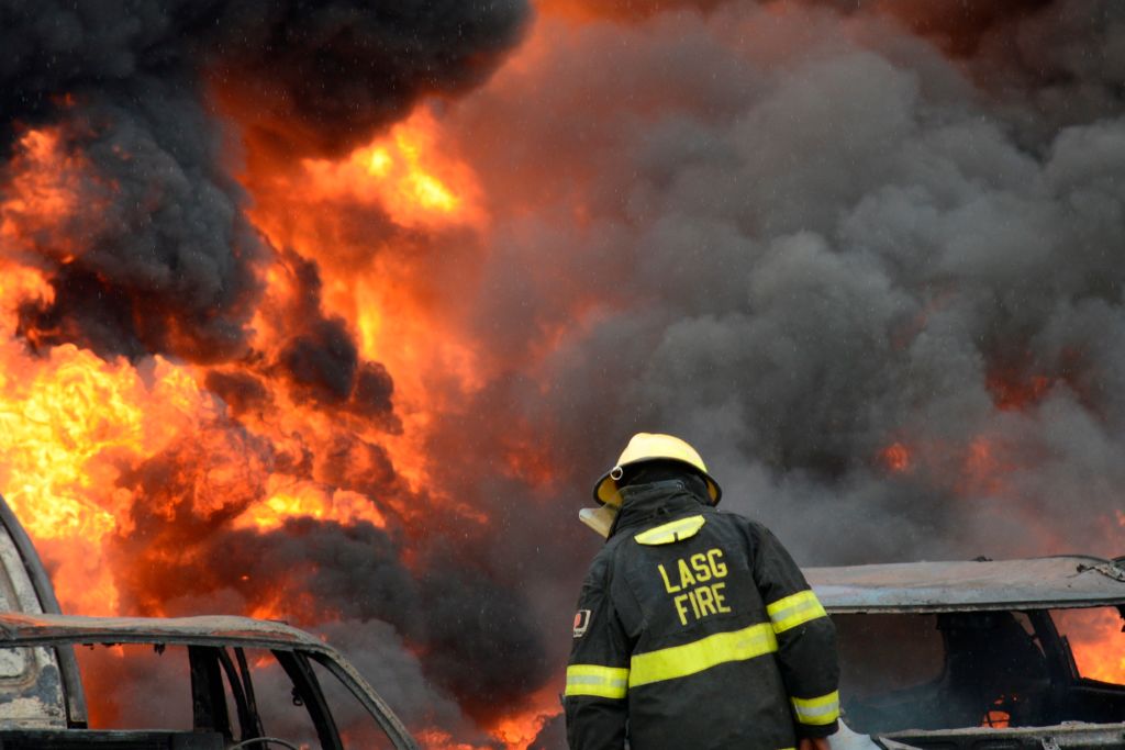 GettyImages-1153780092 Fire fighters try to put out rages on at Ijegun, Lagos, Nigeria