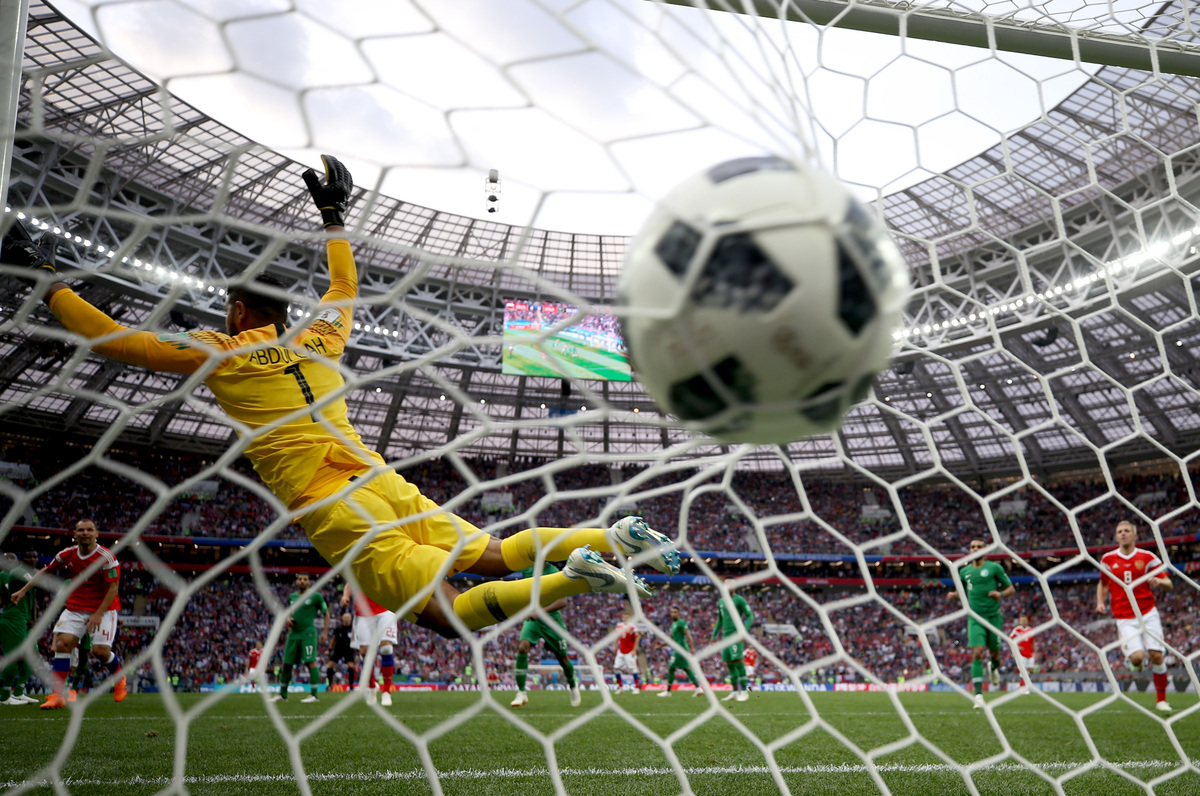 Aleksandr Golovin of Russia scores his team's fifth goal past Abdullah Al Muaiouf of Saudi Arabia during the 2018 FIFA World Cup Russia Group A match between Russia and Saudi Arabia at Luzhniki Stadium on June 14, 2018 in Moscow, Russia.