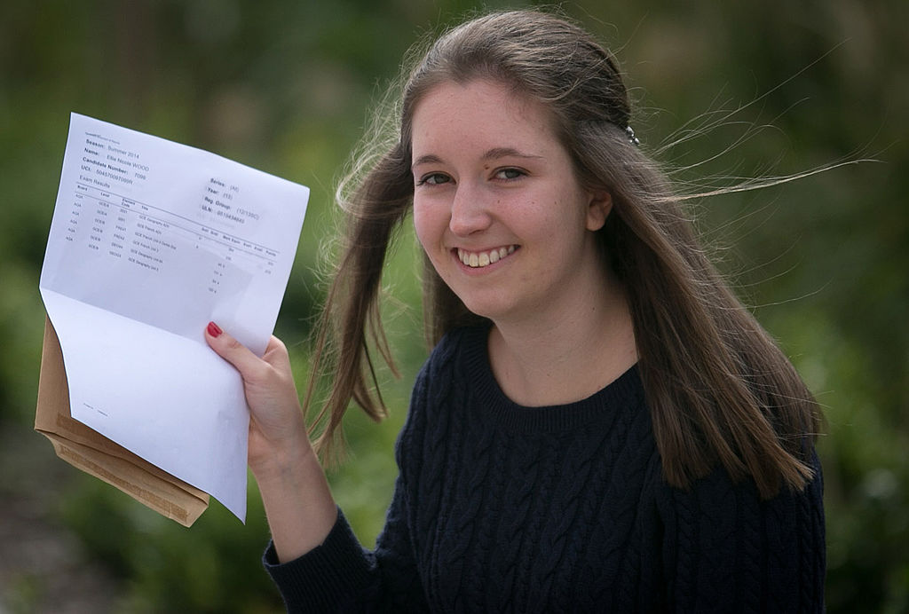 Student holding up her grades 