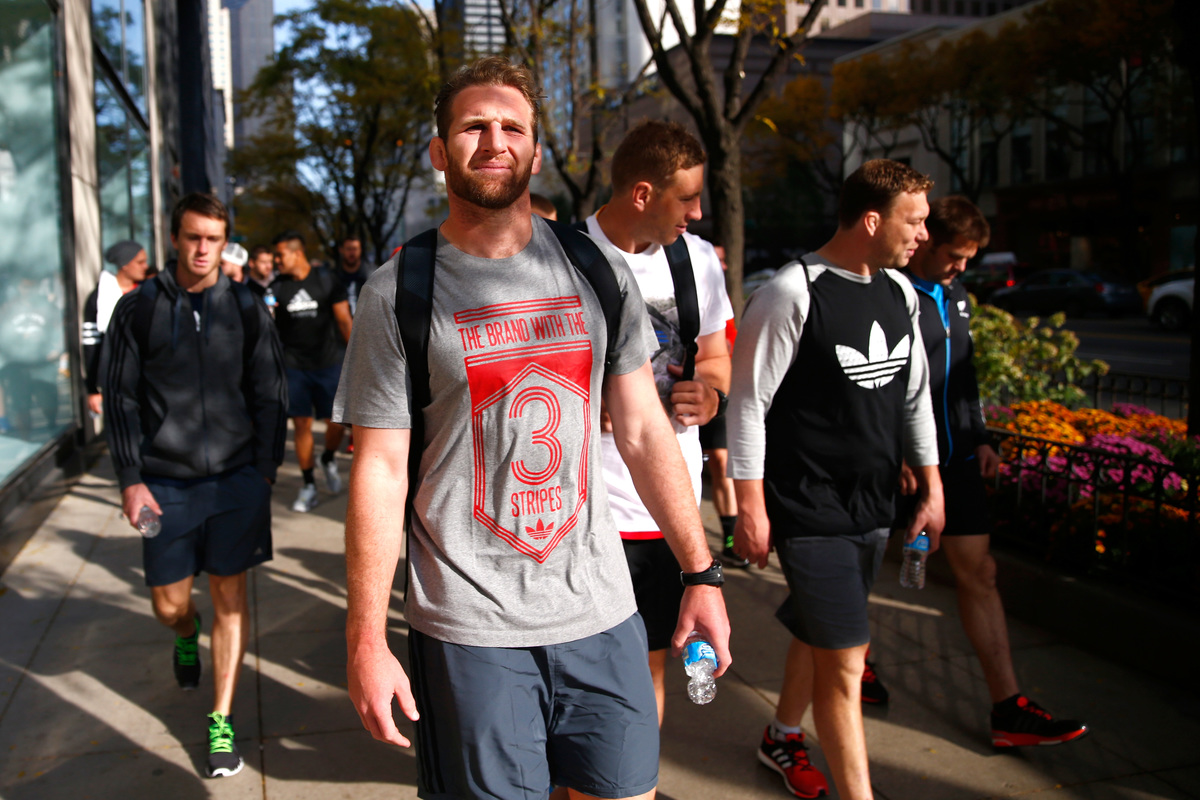 Kieran Read of the New Zealand All Blacks takes in a bit of sightseeing as they walk along Michigan Ave following a pool recovery session on October 27, 2014 in Chicago, Illinois.