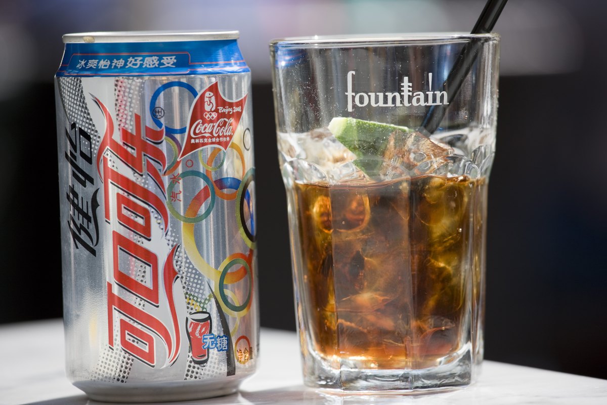 Chinese Diet Coca-Cola can and Fountain Bistro glass in Xintiandi area, Huang Pi Road, Shanghai, China 