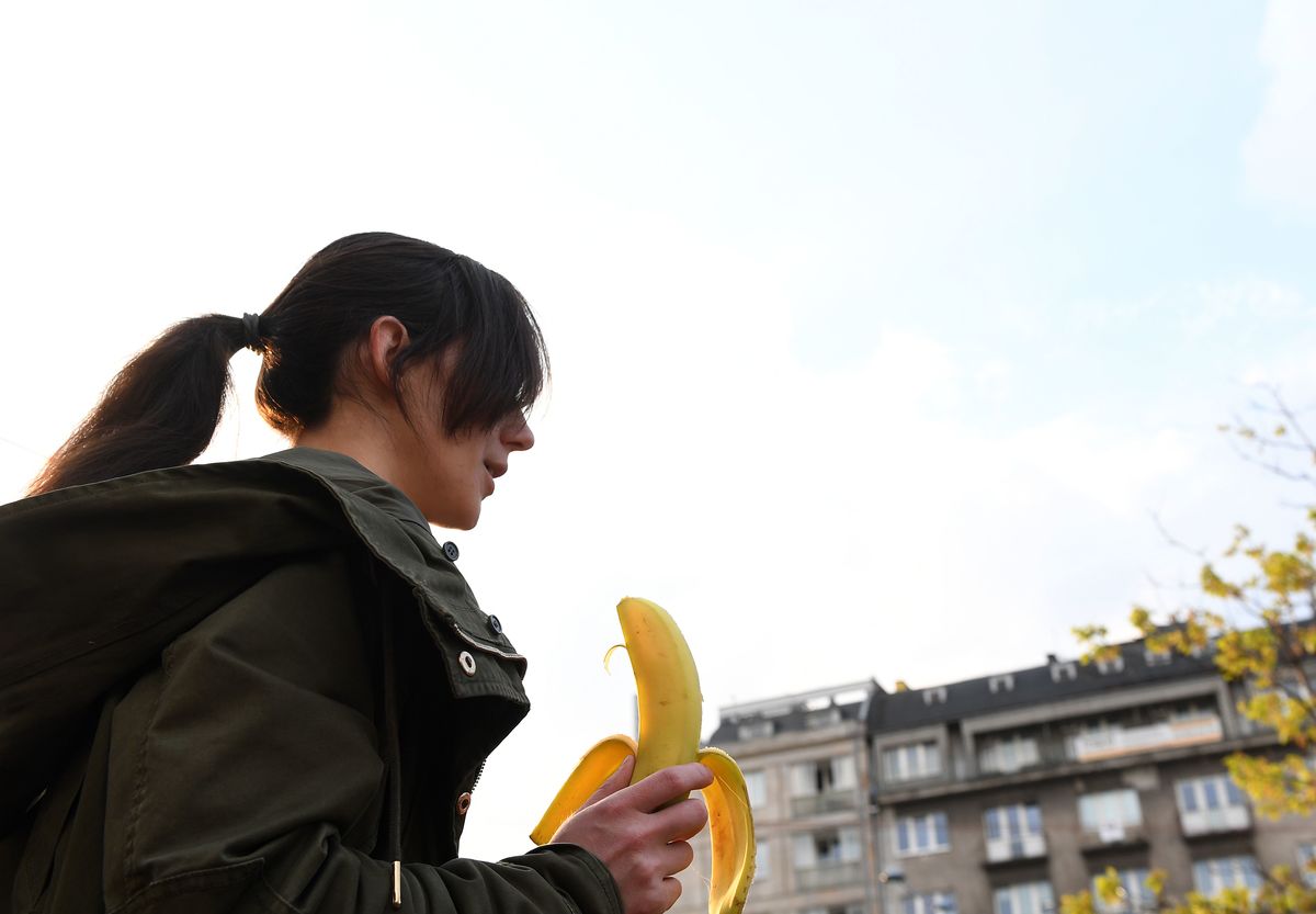 A woman with a banana demonstrates outside Warsaw's National Museum to protest against censorship