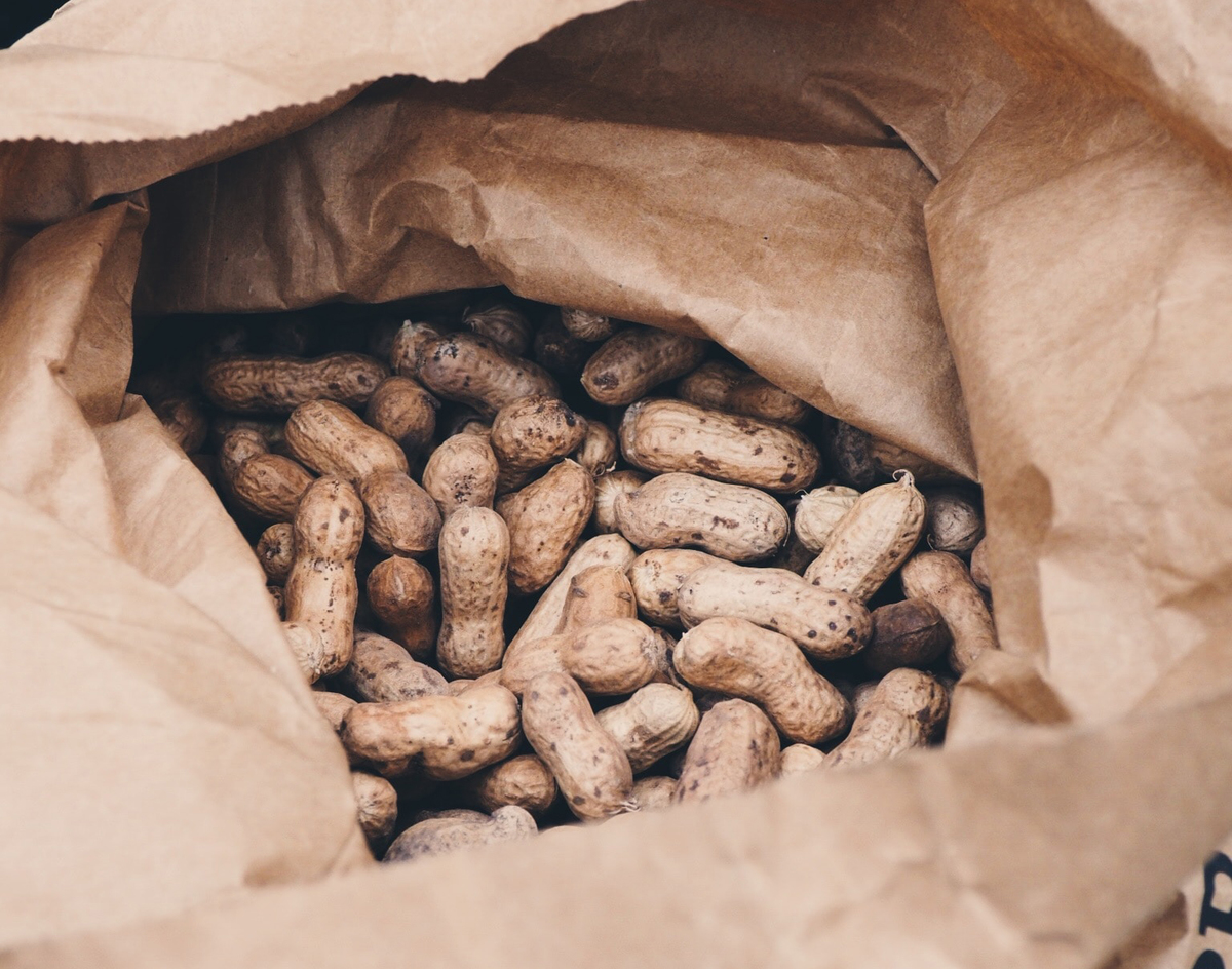 Opened paper bag of peanuts from Dăbuleni, Romania