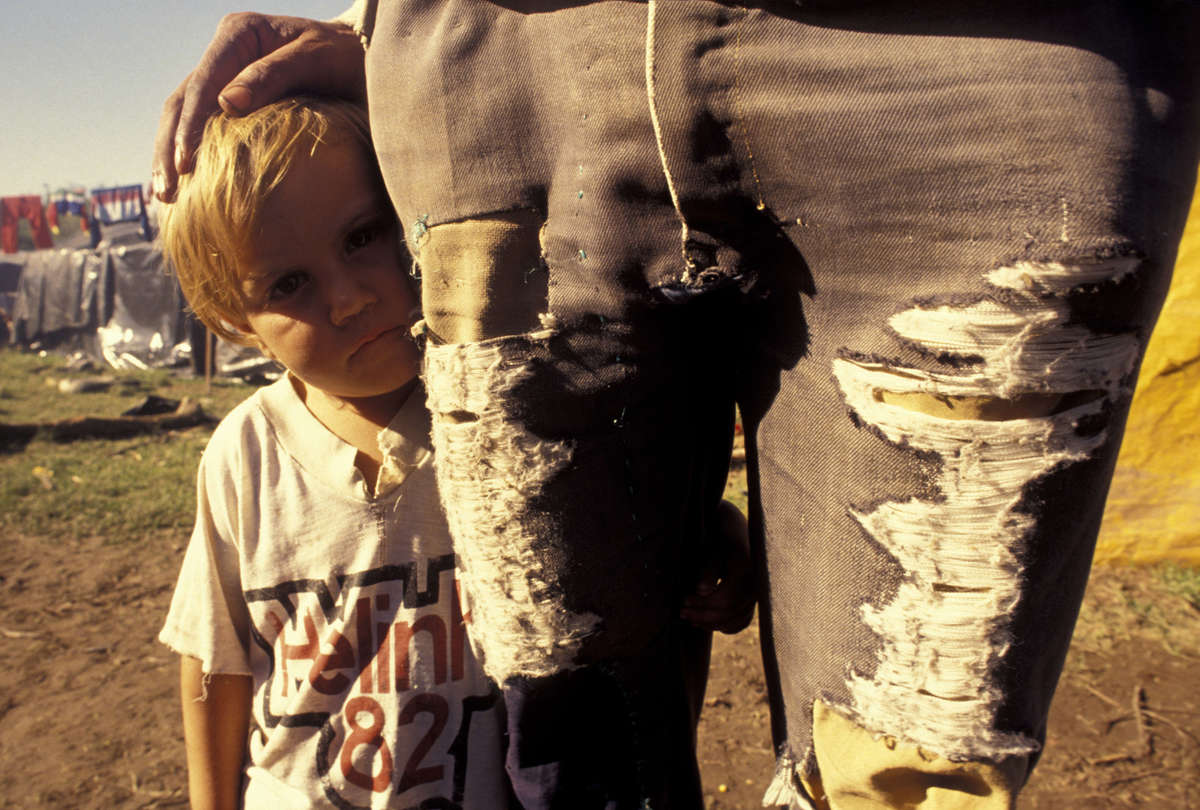 Portrait of father and 5-years-old boy at landless movement...