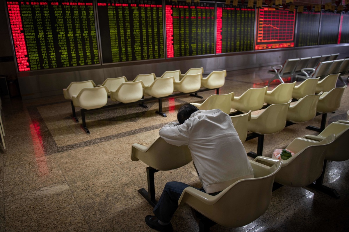 a man rests at the stock market