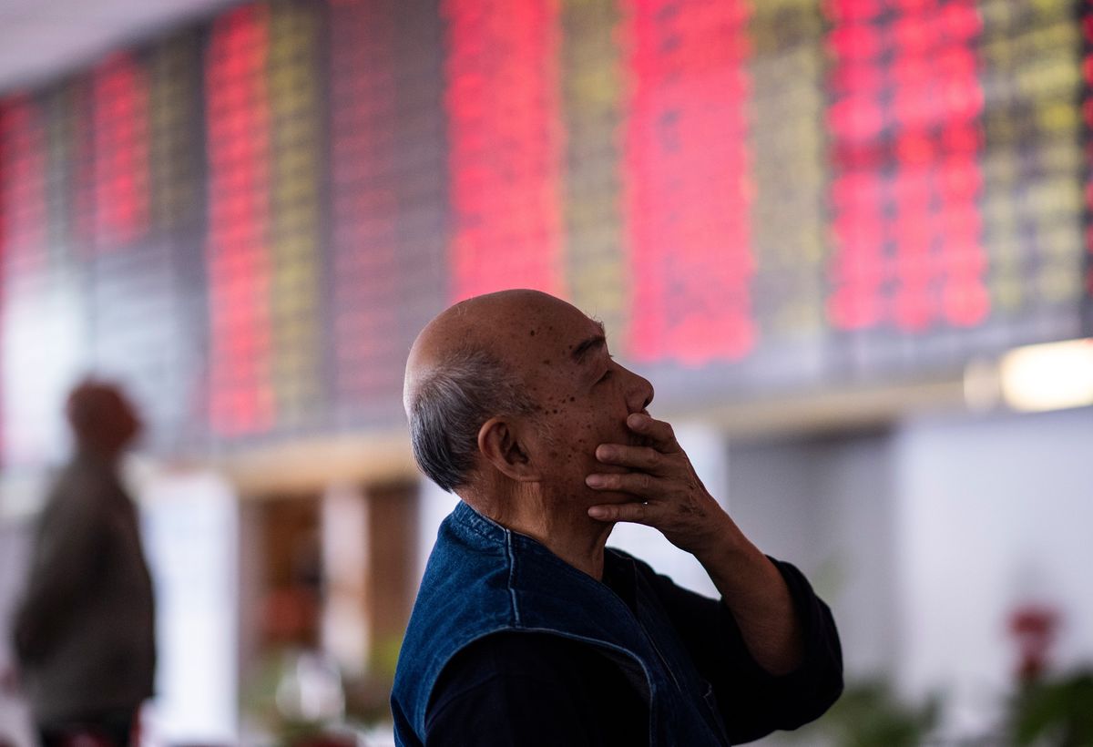 a man checks the market reports