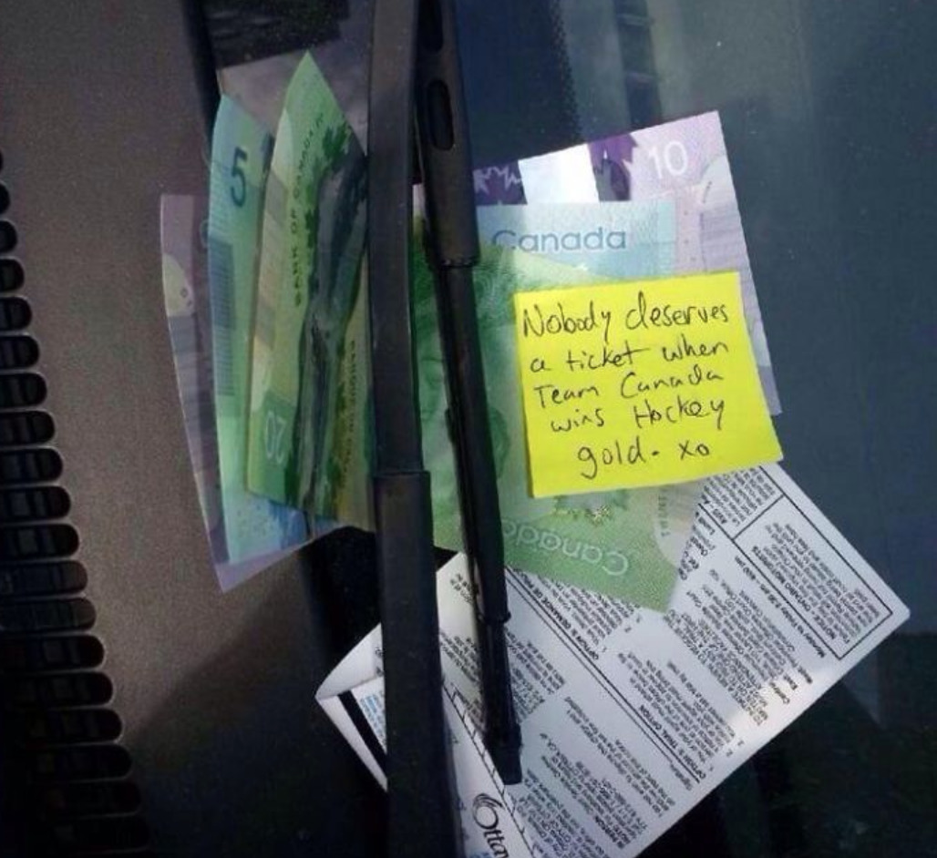 Stranger leaves cash on person's windshield to pay off parking ticket the just received