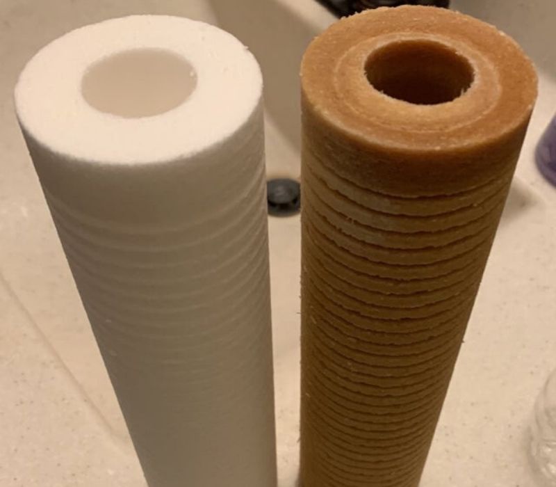 brown water filter versus white new one