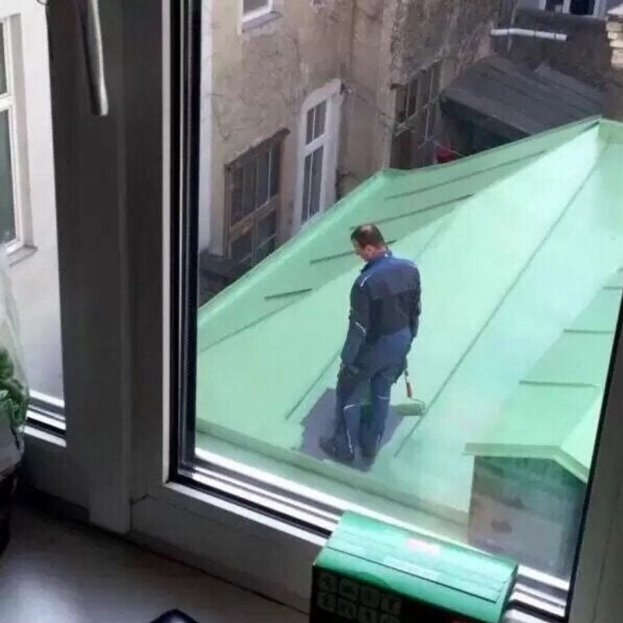 painter stranded on roof after painting all around him