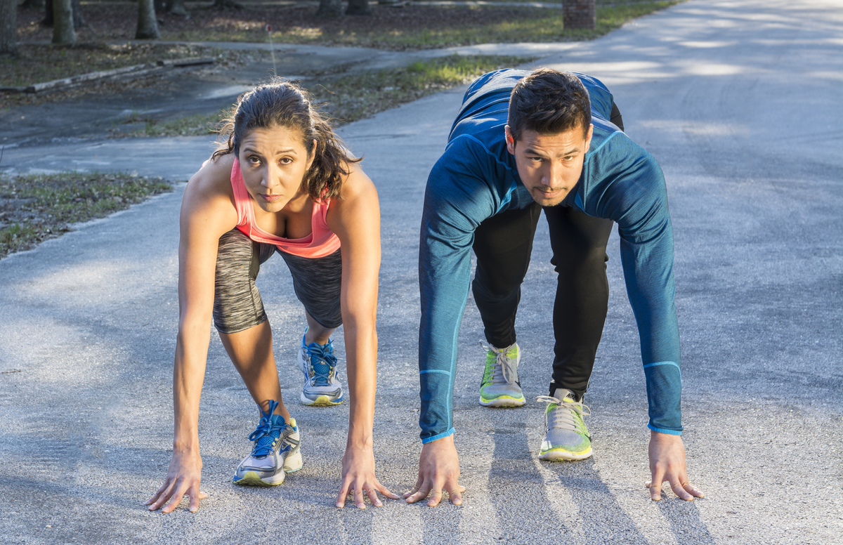 Young couple running starting line