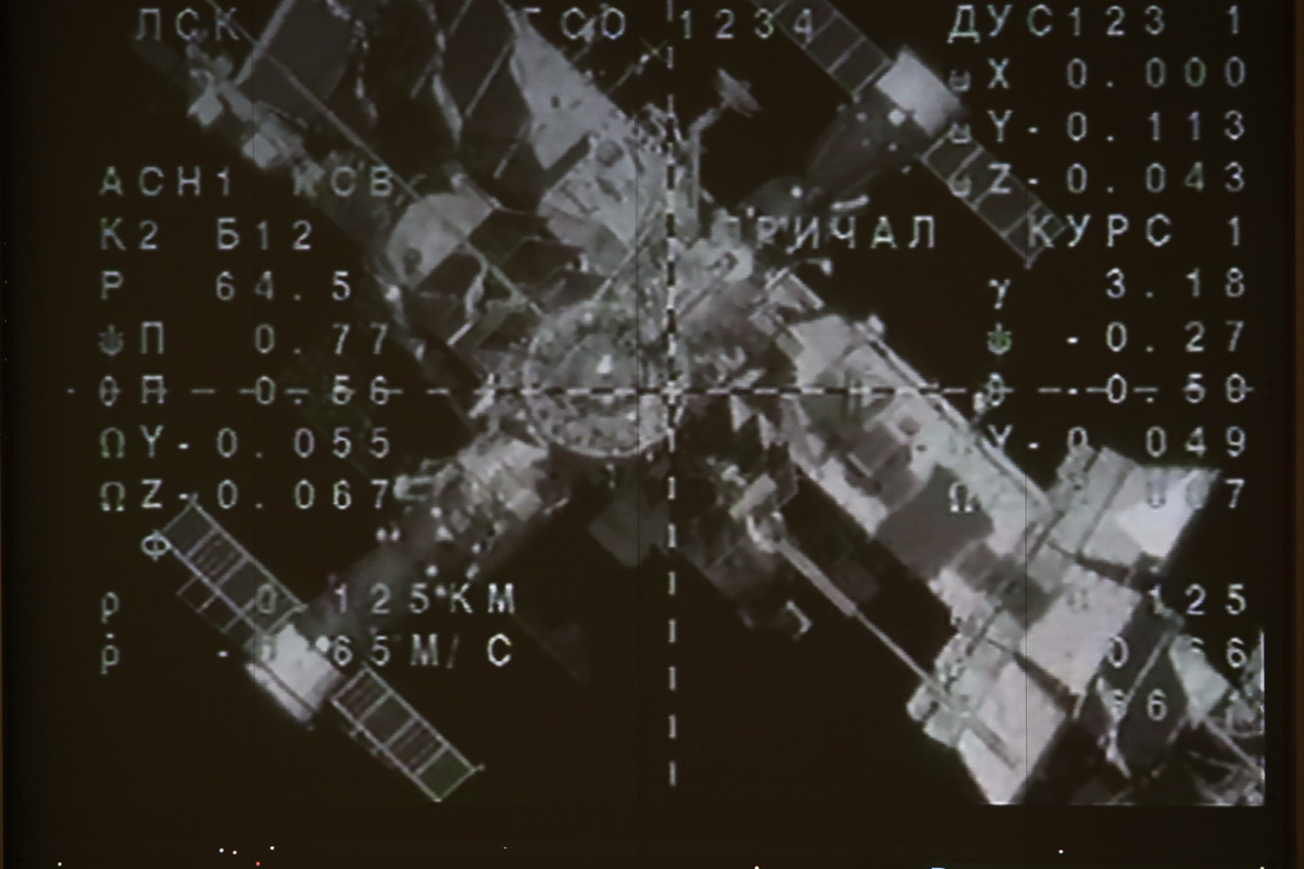 A screen broadcasting the redocking of the Soyuz MS-14 spacecraft