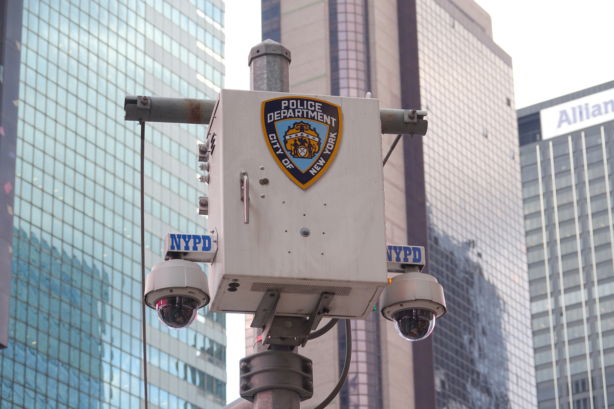 The logo of the New York City Police Department (NYPD) stands on a surveillance camera near Times Square.