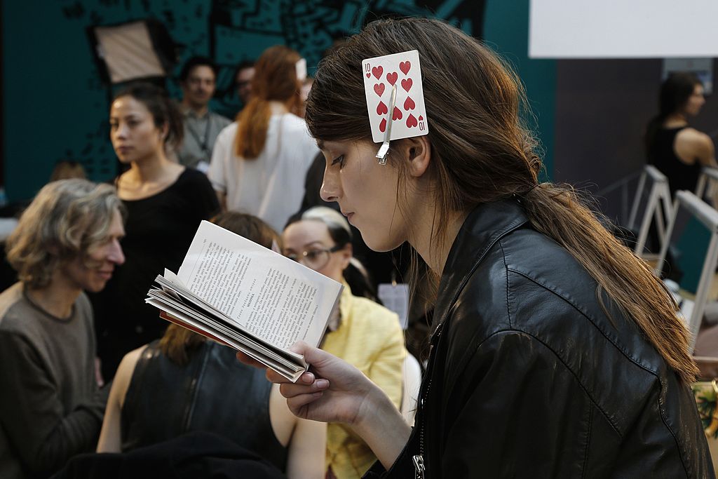 a french woman with a playing card in he hair