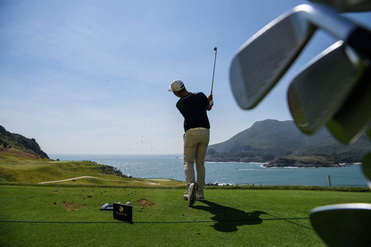 Chinese golfer Lin Yuxin warms up on the driving range prior to teeing off at the first hole at the Clearwater Bay Golf Club in Hong Kong.