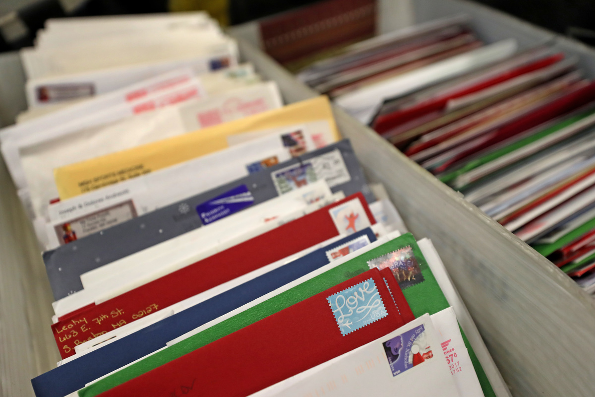 Cards in bins are ready to process at a United States Postal Service facility.
