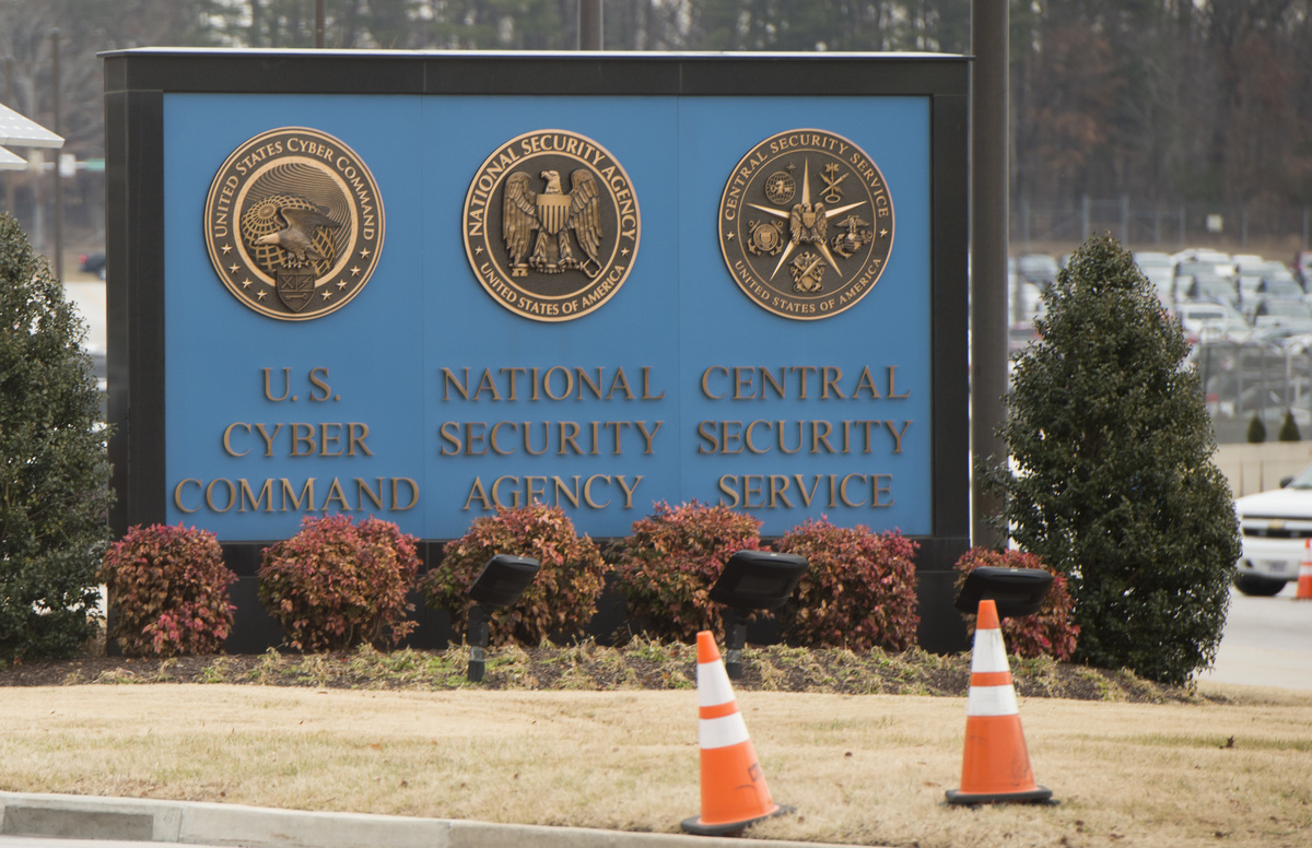 A sign for the National Security Agency, US Cyber Command and Central Security Service, is seen near the visitor's entrance to the headquarters of the NSA.