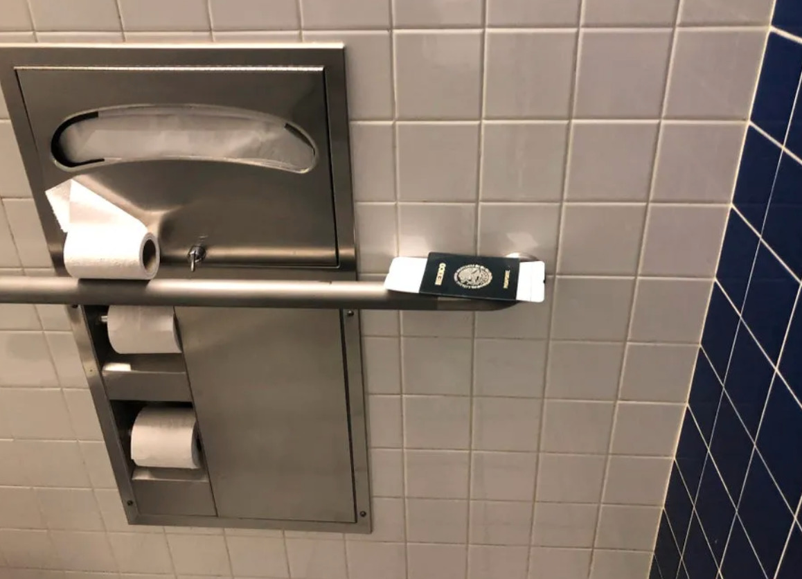 person left passport with boarding pass on ledge in airport washroom