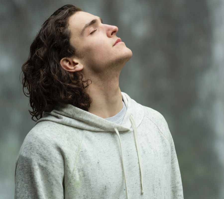 a guy taking a deep breath