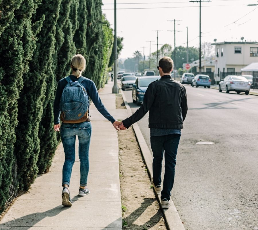 couple walking and holding hands