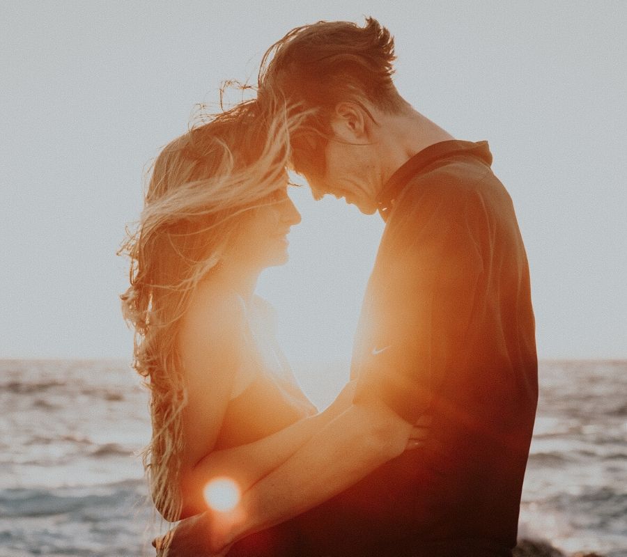 cheesy beach picture of couple