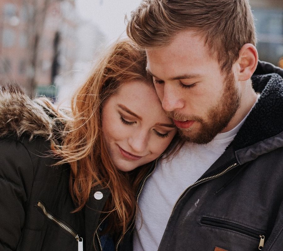 couple hugging in the winter