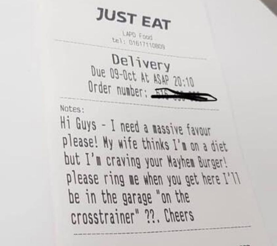 a note asking a delivery person to take their order to the garage 