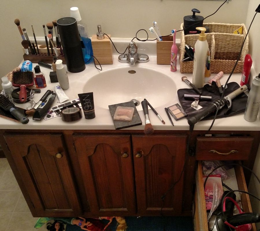 a bathroom full of make up and hair stuff
