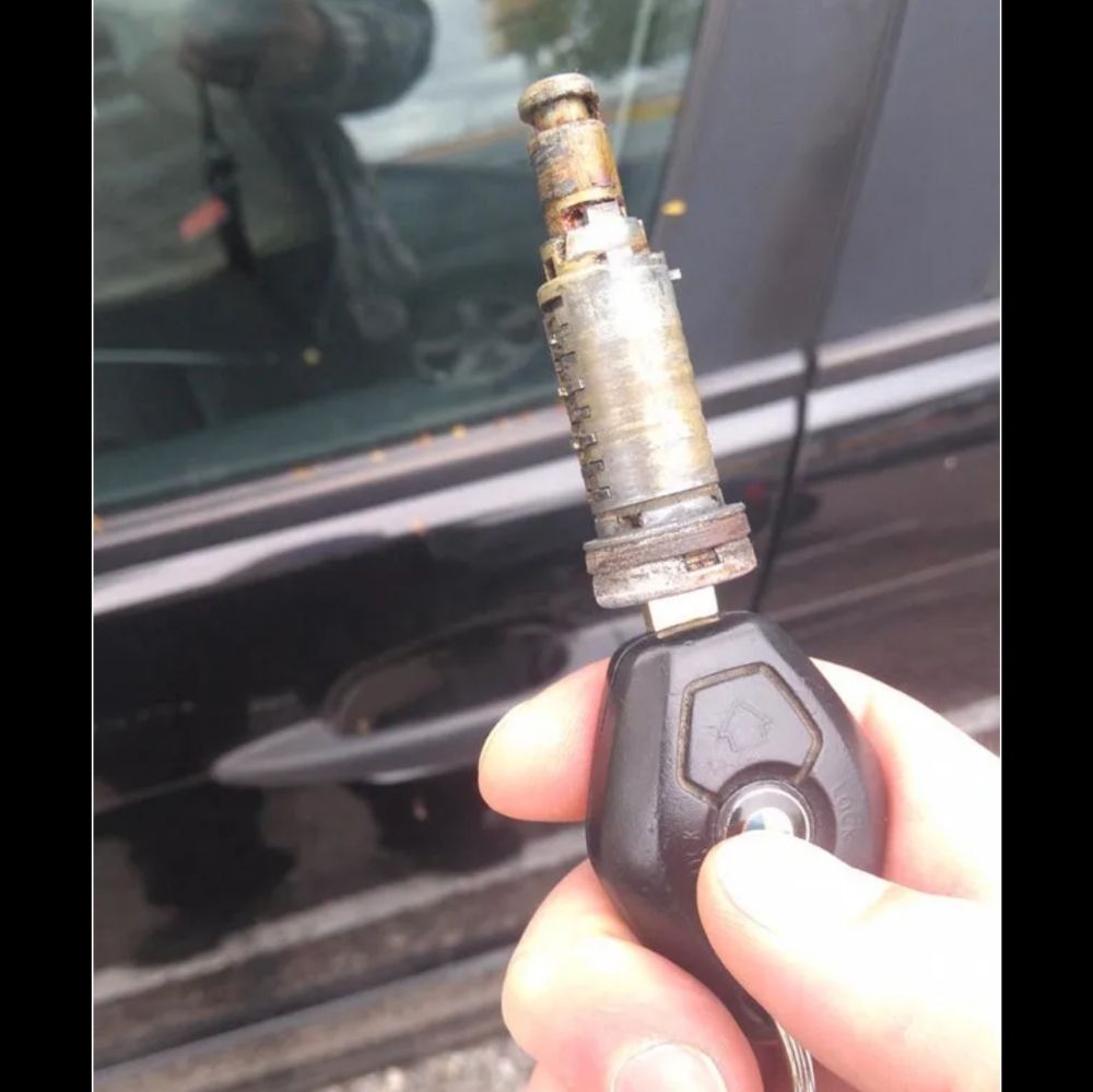 Car key with entire lock mechanism pulled out of car