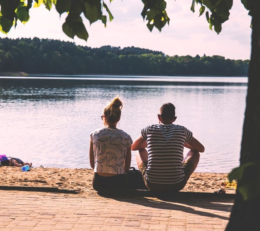 couple sitting by the water
