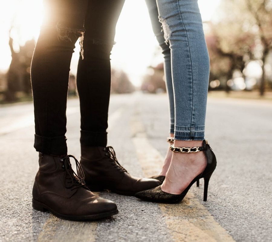 two people standing on the street