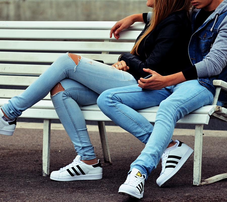 a couple sitting on a bench