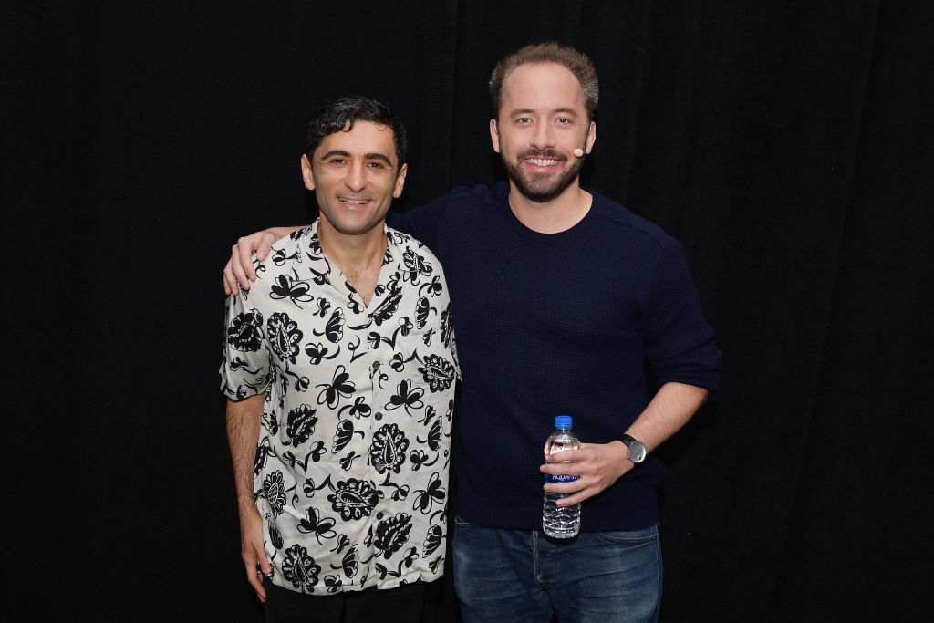 arash ferdowsi and drew houston pose for a photo