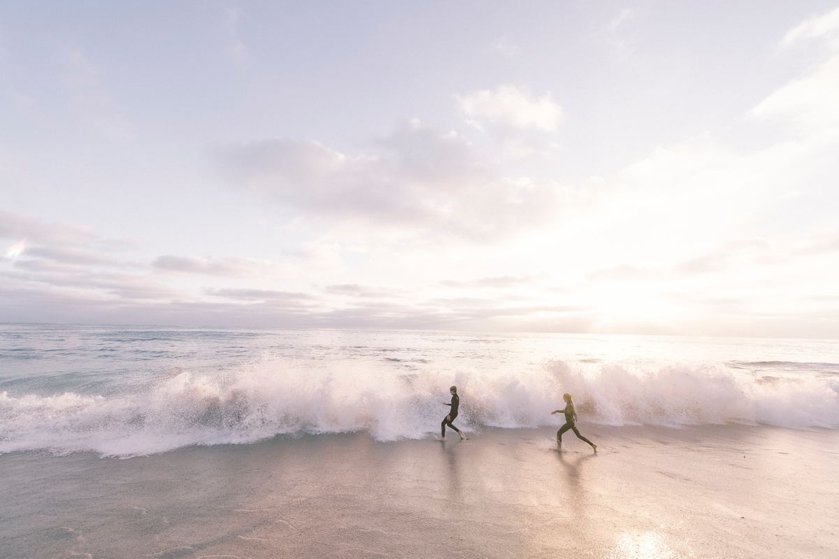 couple running on beach
