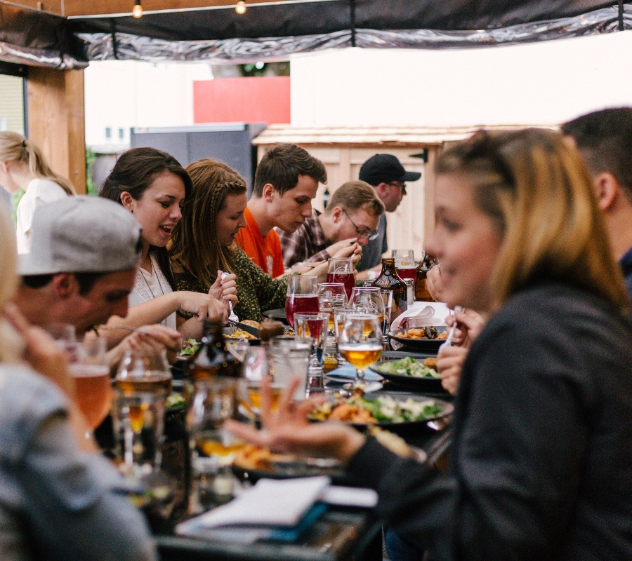 people sitting around a table talking 