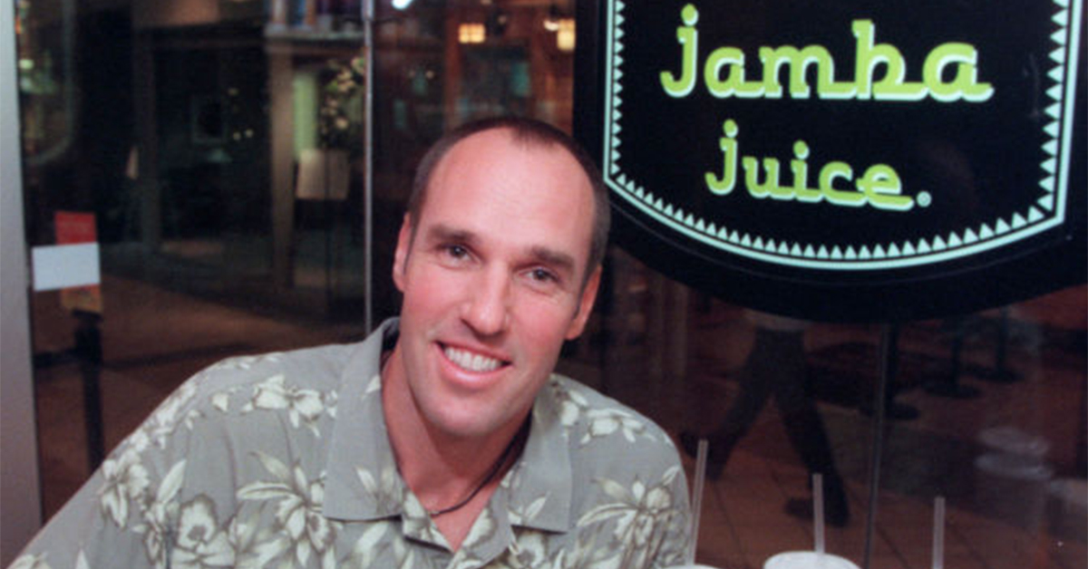kirk perron next to the jamba juice logo