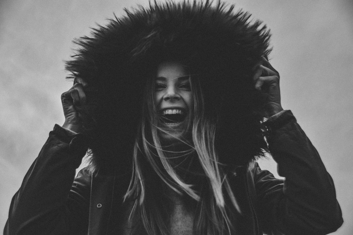 girl ecstatically laughing