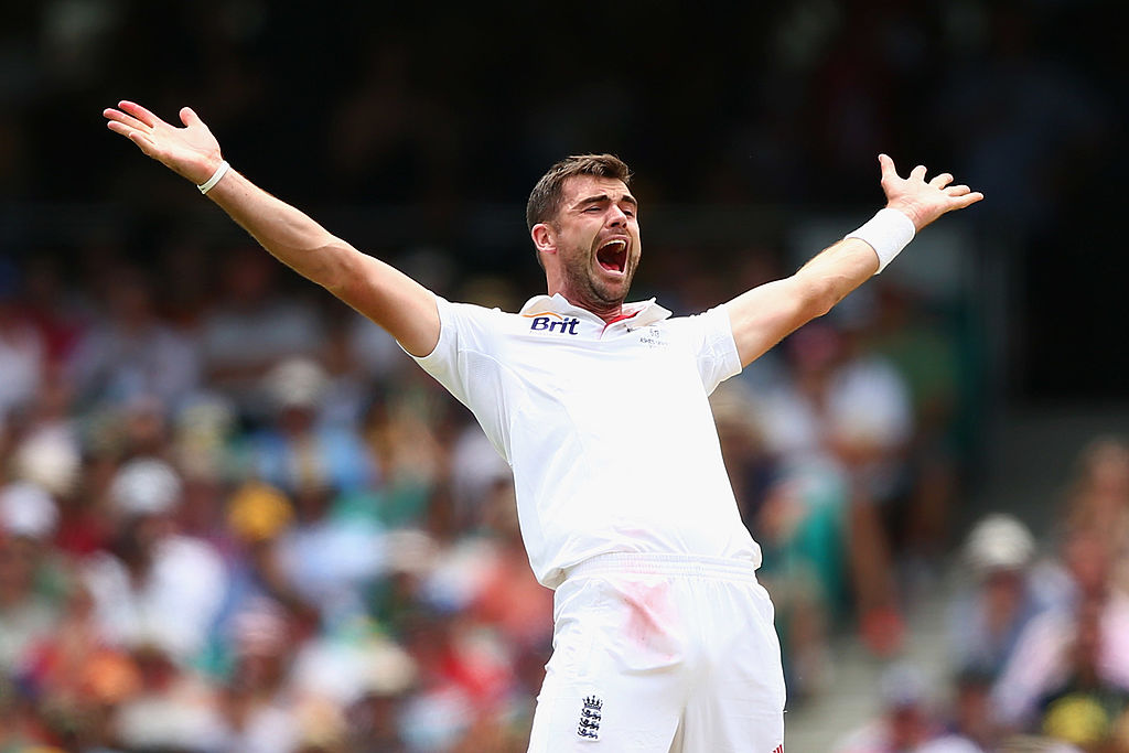 An overjoyed athlete holds his arms open wide.