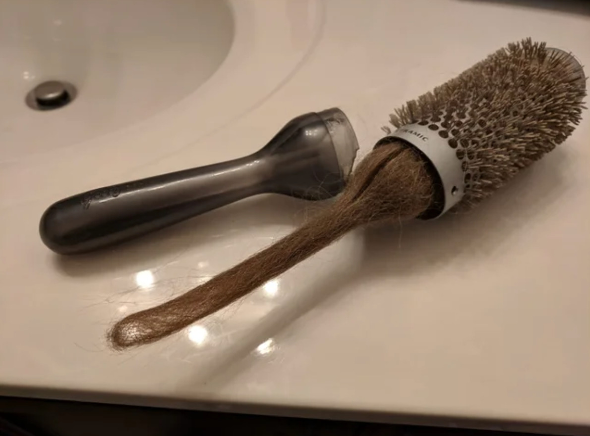 hairbrush with broken handle reveals hair inside