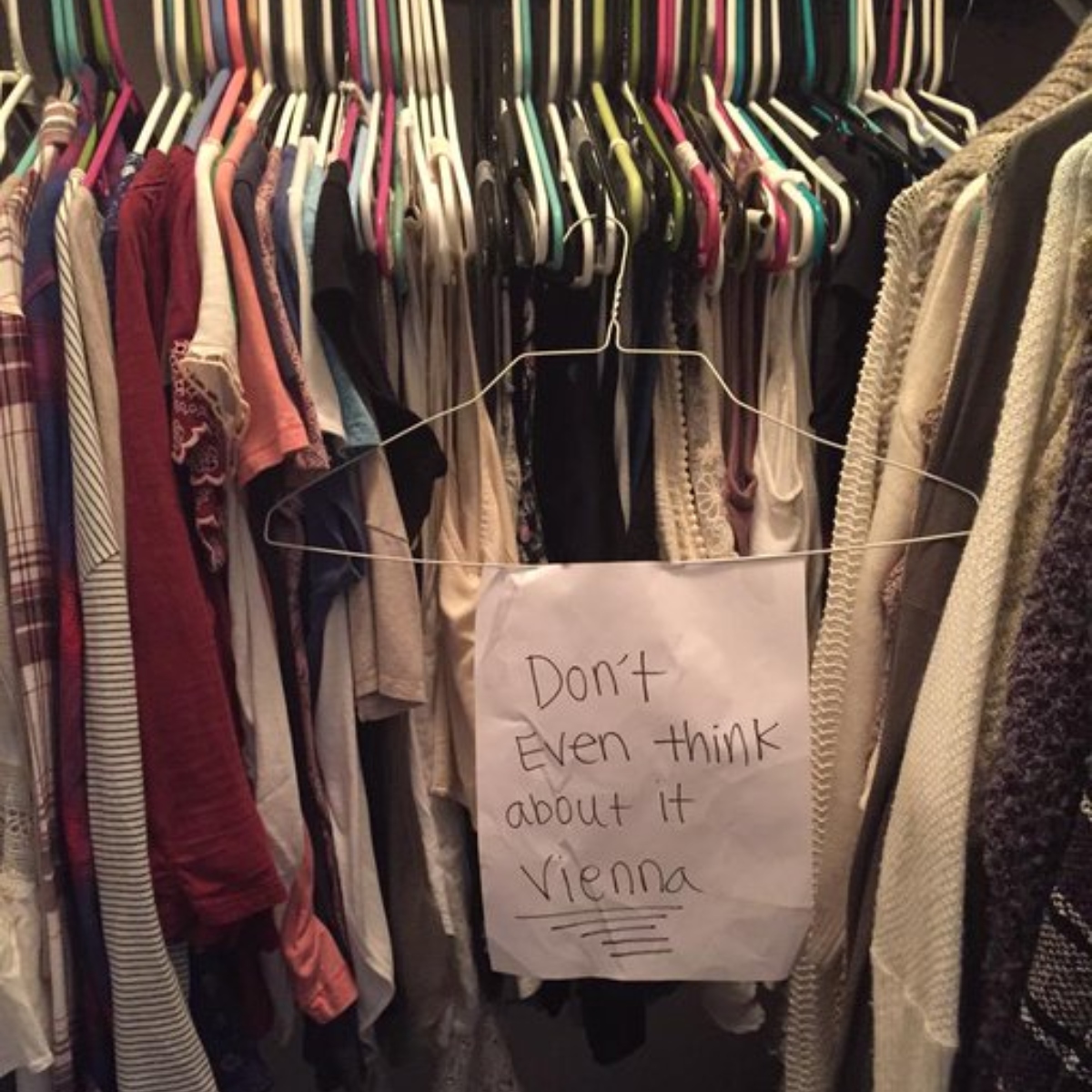 sister hanging sign on her closet
