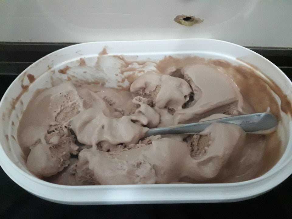 spoon left in ice cream tub 