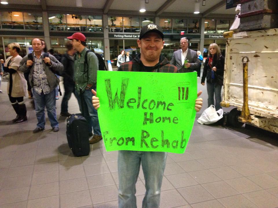 welcome home from rehab sign at airport