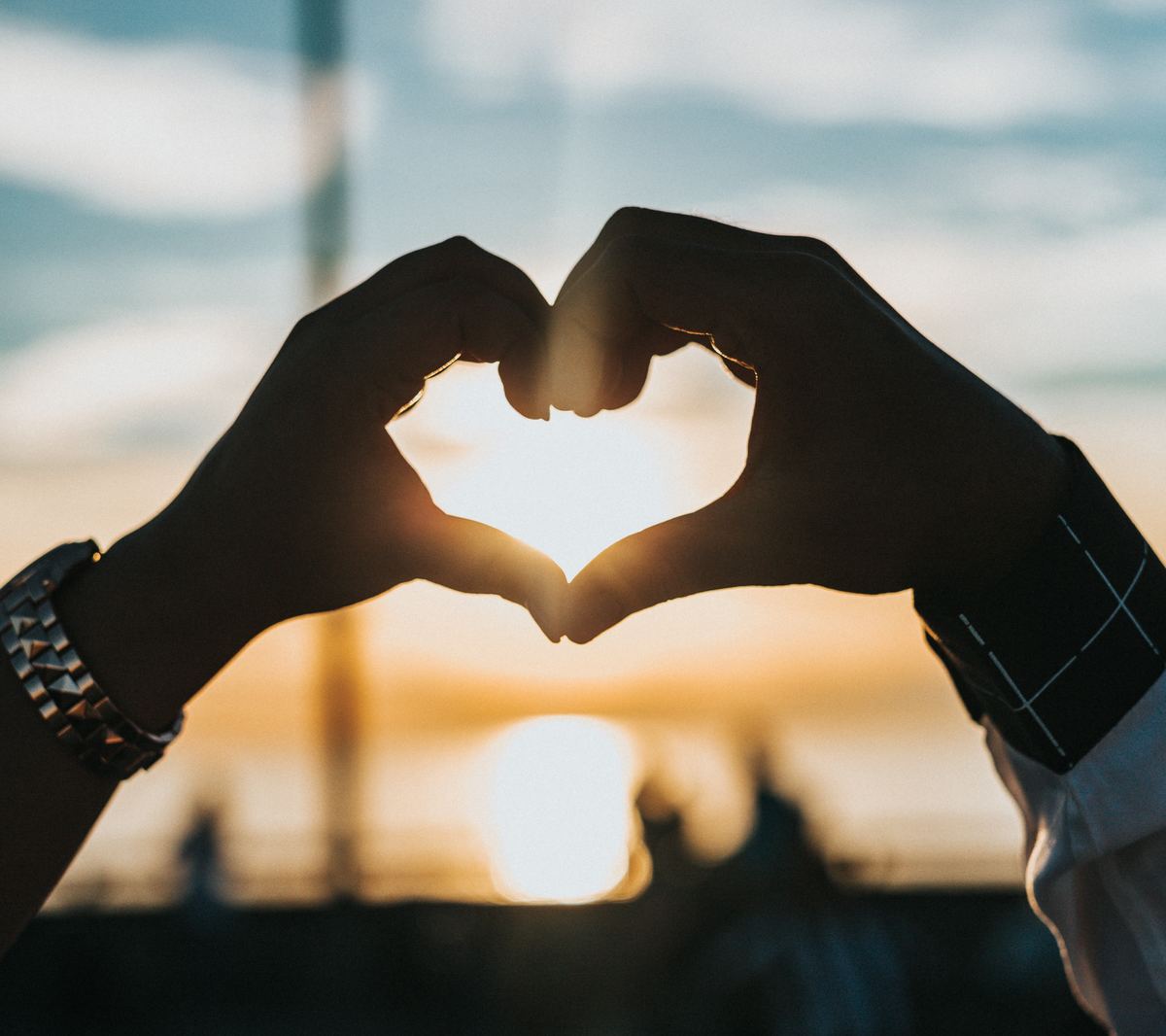 two hands form heart shape