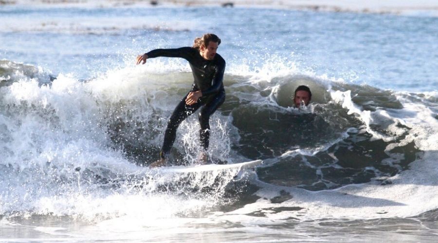 two people surfing