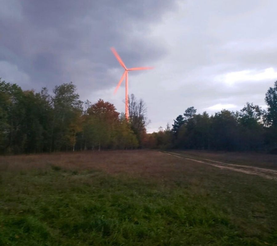 a wind turbine looks pink