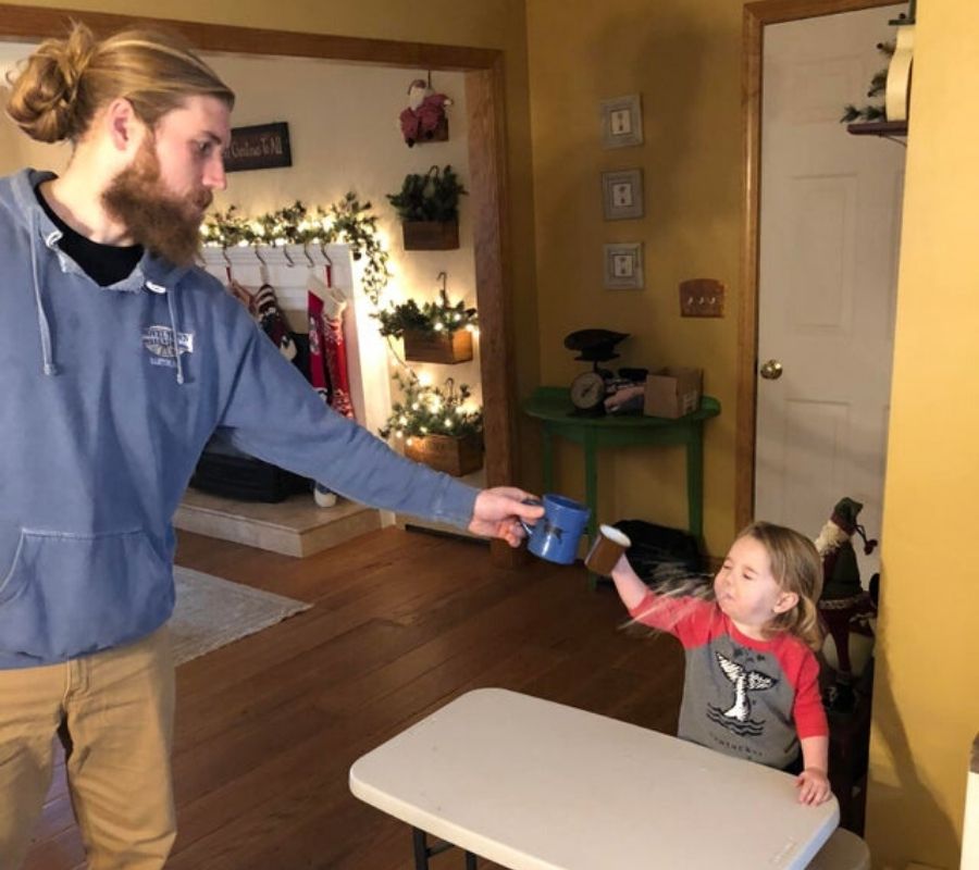 a kid spitting chocolate milk out their nose
