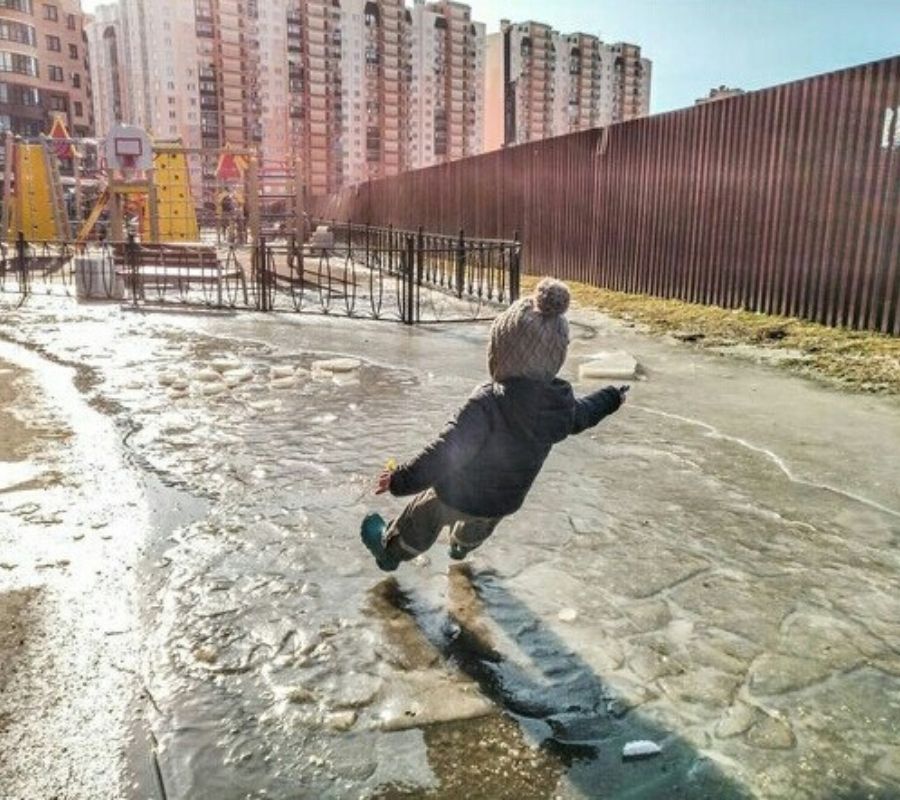 a kid slipping on the ice