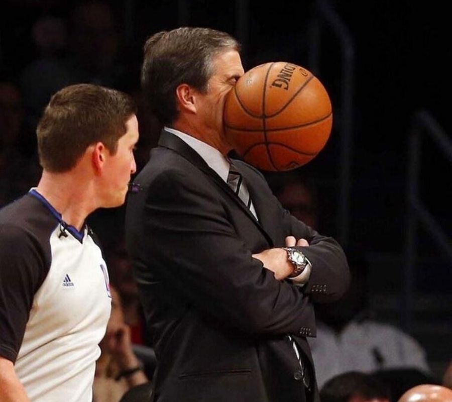 someone getting hit in the face with a basketball